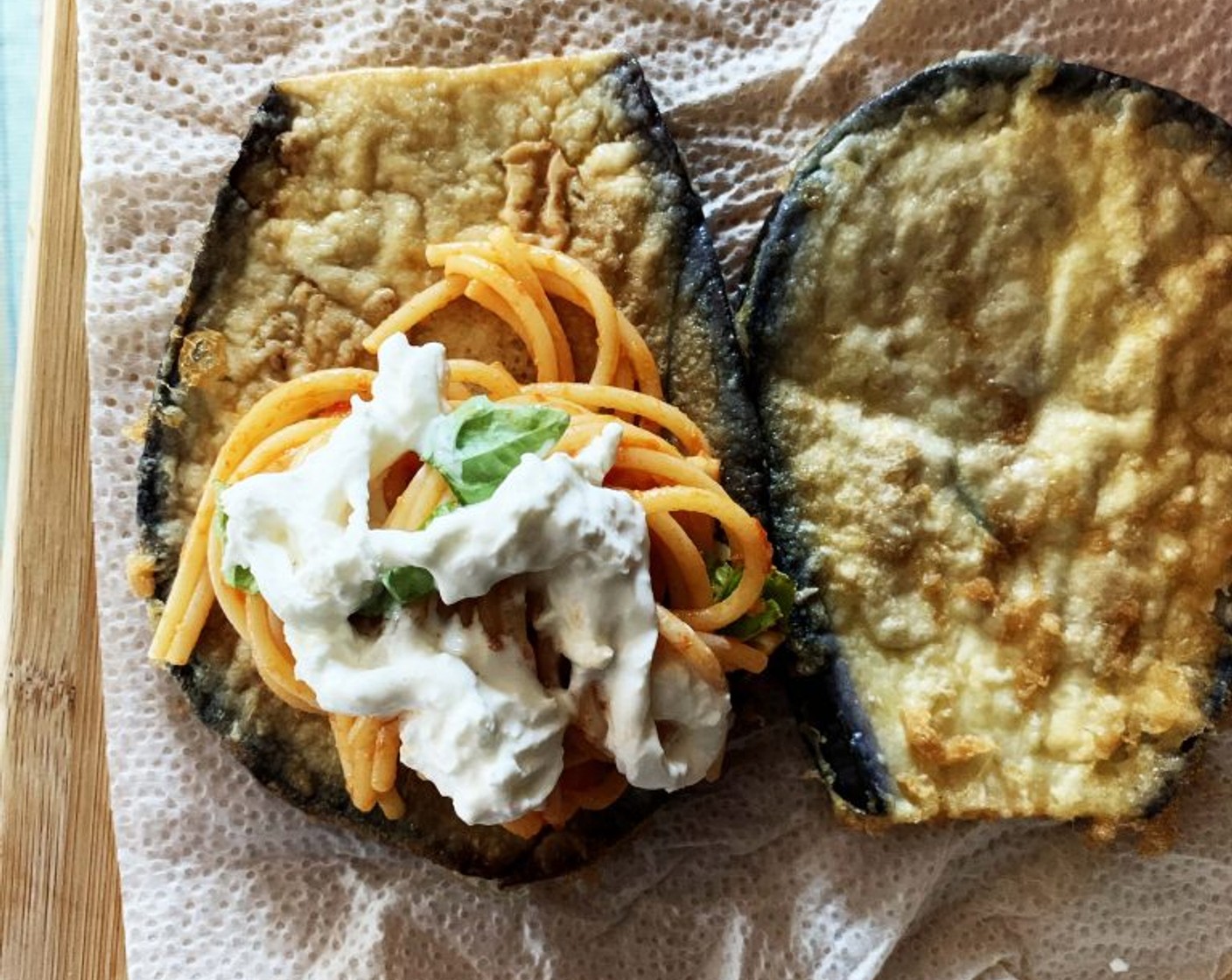 step 3 Next drop a few tablespoons of Tomato Sauce (3 1/3 Tbsp) at the bottom of a casserole dish. Take one slice of eggplant, with a fork, roll up some spaghetti and place them on the eggplant, then add some Fresh Basil (to taste) and Stracciatella Cheese (1/3 cup).
