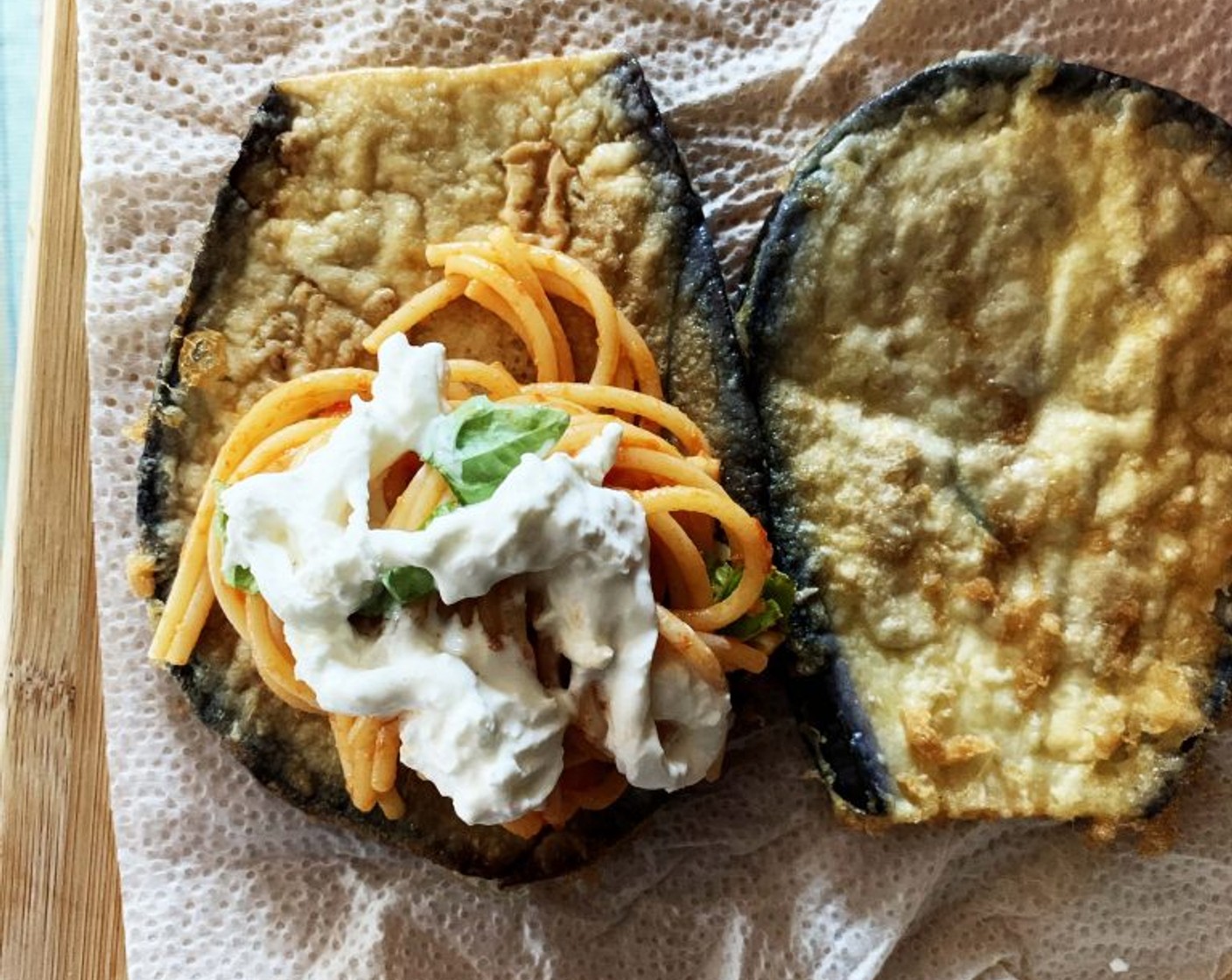 step 3 Next drop a few tablespoons of Tomato Sauce (3 Tbsp) at the bottom of a casserole dish. Take one slice of eggplant, with a fork, roll up some spaghetti and place them on the eggplant, then add some Fresh Basil (to taste) and Stracciatella Cheese (1/3 cup).