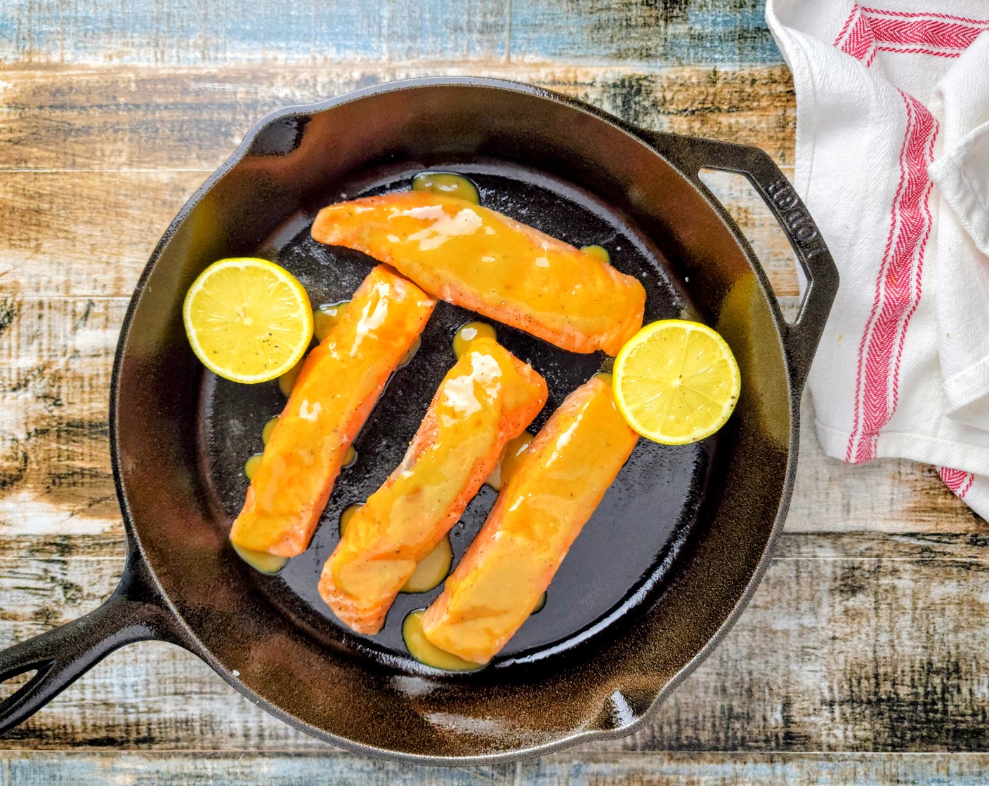 step 5 Add the Olive Oil (3 Tbsp) to a cast iron pan and place the salmon fillets flat side down. Spoon the brown sugar sauce over the tops of the salmon fillets.