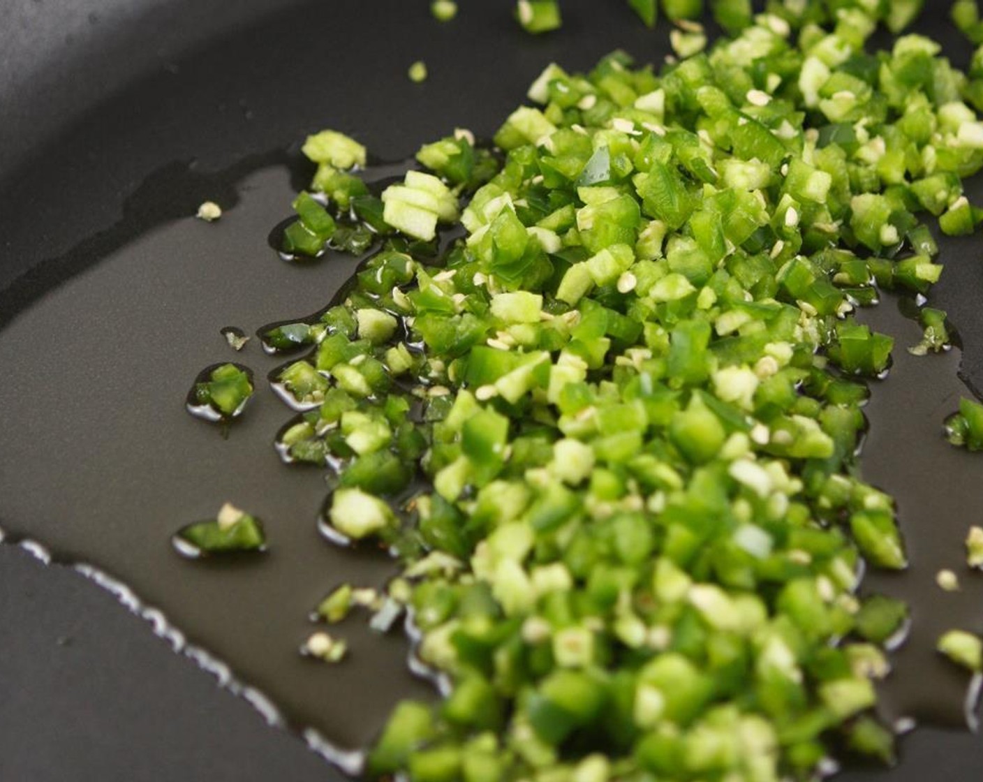 step 3 Heat the Extra-Virgin Olive Oil (2 Tbsp) in a large skillet over medium heat. Add the Jalapeño Pepper (1) and cook for 3 minutes, or until soft and fragrant.