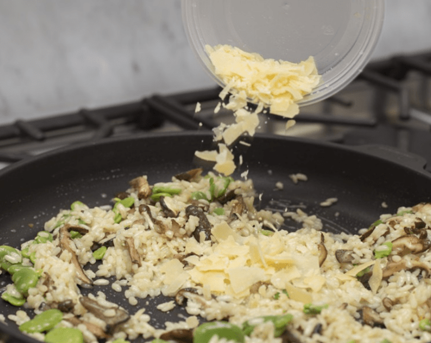 step 13 Stir in peeled fava beans and sauteed mushrooms. Remove from heat, and vigorously stir in Butter (to taste), Parmesan Cheese (to taste), and chopped parsley. Taste, and adjust seasoning as desired with kosher salt.