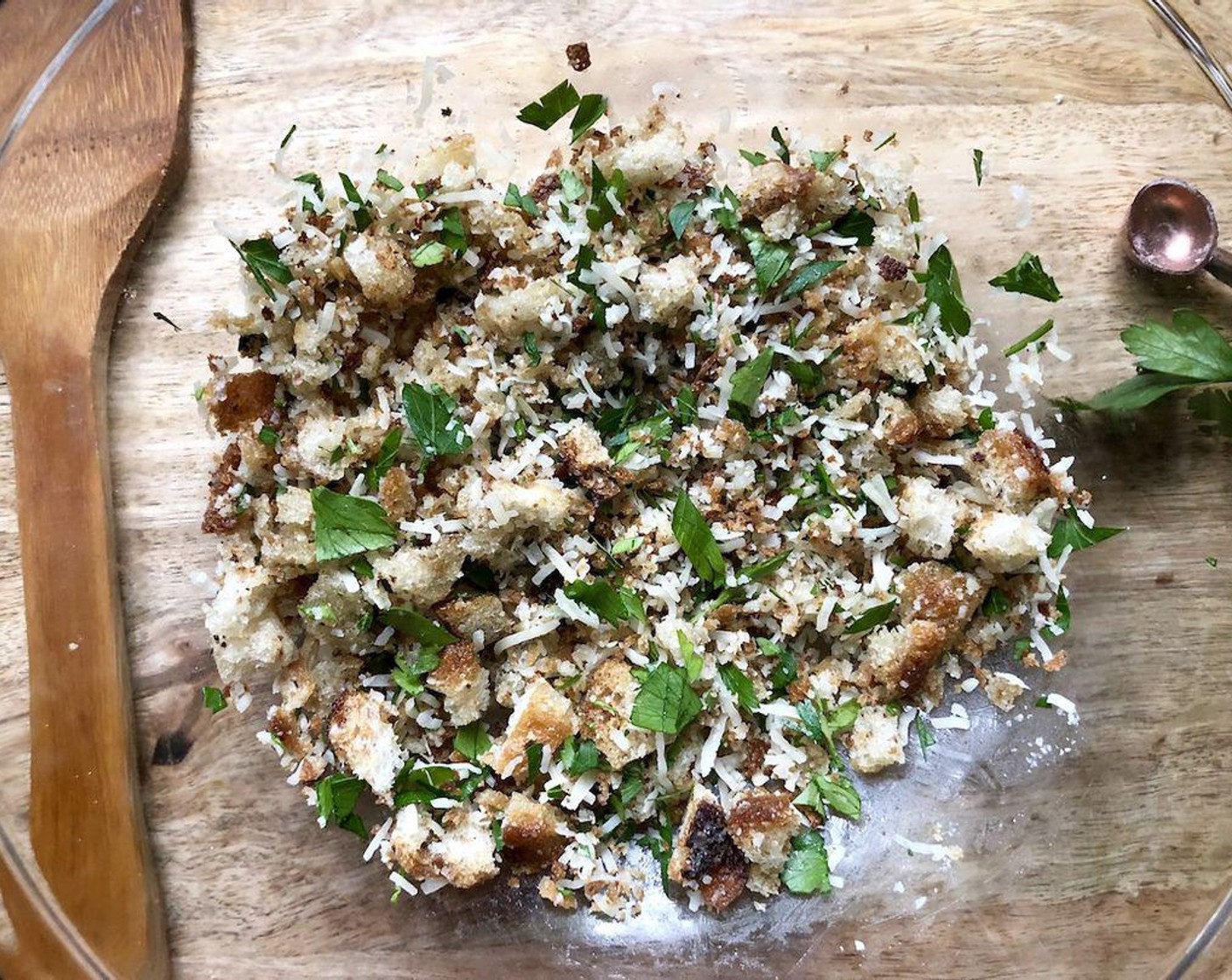 step 3 Add the Breadcrumbs (1/2 cup) to the skillet; cook 4 minutes or until golden. Transfer to a small bowl; stir in the chopped garlic, 1/4 teaspoon Salt (to taste) and 1/8 teaspoon Freshly Ground Black Pepper (to taste); let cool. Stir in the Shredded Parmesan Cheese (1/4 cup) and chopped Italian Flat-Leaf Parsley (1 Tbsp).