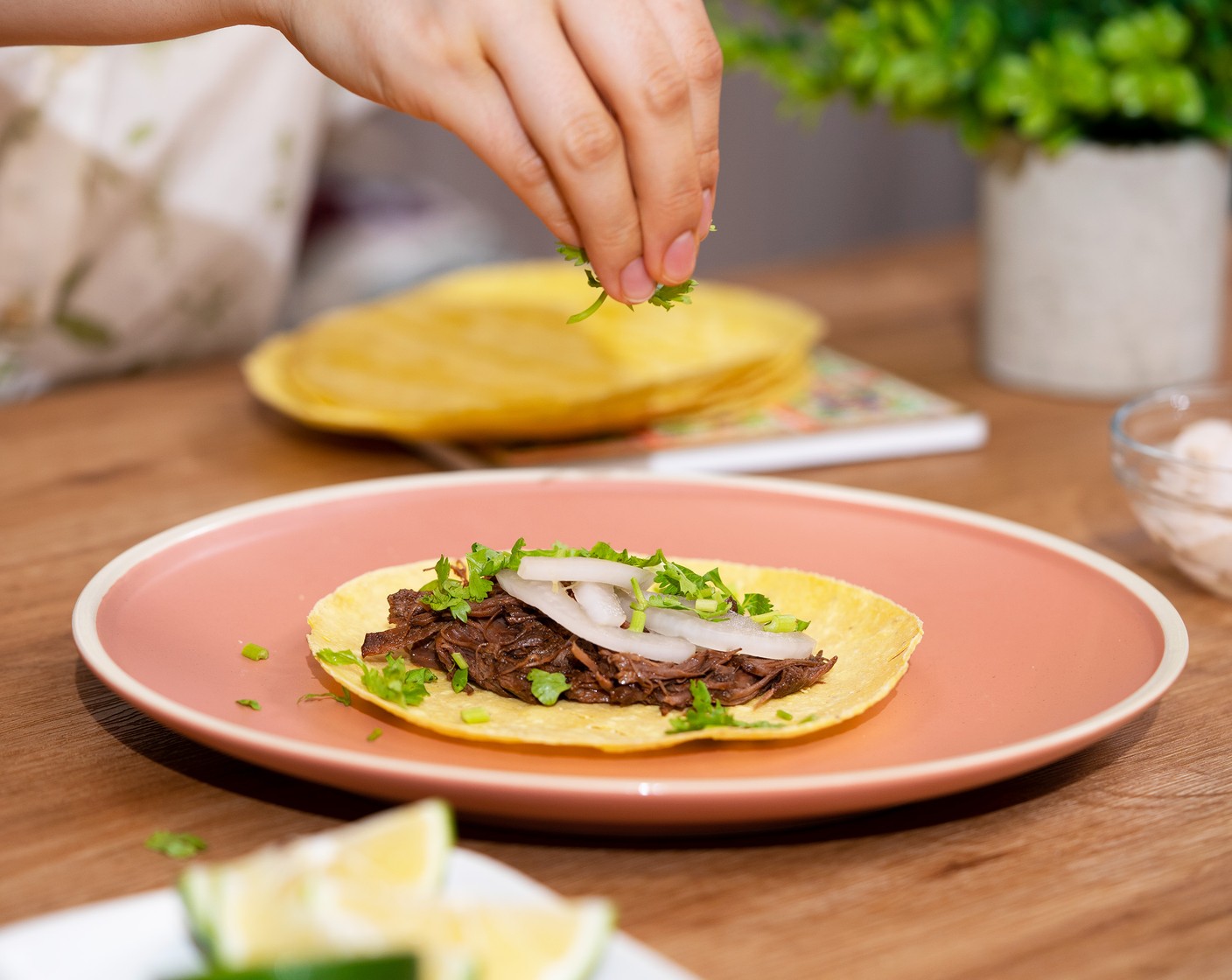 step 9 Assemble tacos on 6-Inch Corn Tortillas (24). Top with beef, Pickled Red Onions (to taste), and sprinkle some Fresh Cilantro (to taste). Serve with the broth for dipping, and squeeze some Limes (to taste) if needed.