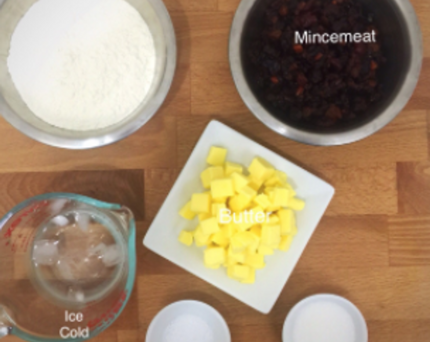 step 1 First, have ready all ingredients needed including All-Purpose Flour (1 1/4 cups), Jarred Fruit Mincemeat (1 cup), Water (3 Tbsp), Salt (1/2 tsp) and Granulated Sugar (1 Tbsp) to make the festive mince pies.