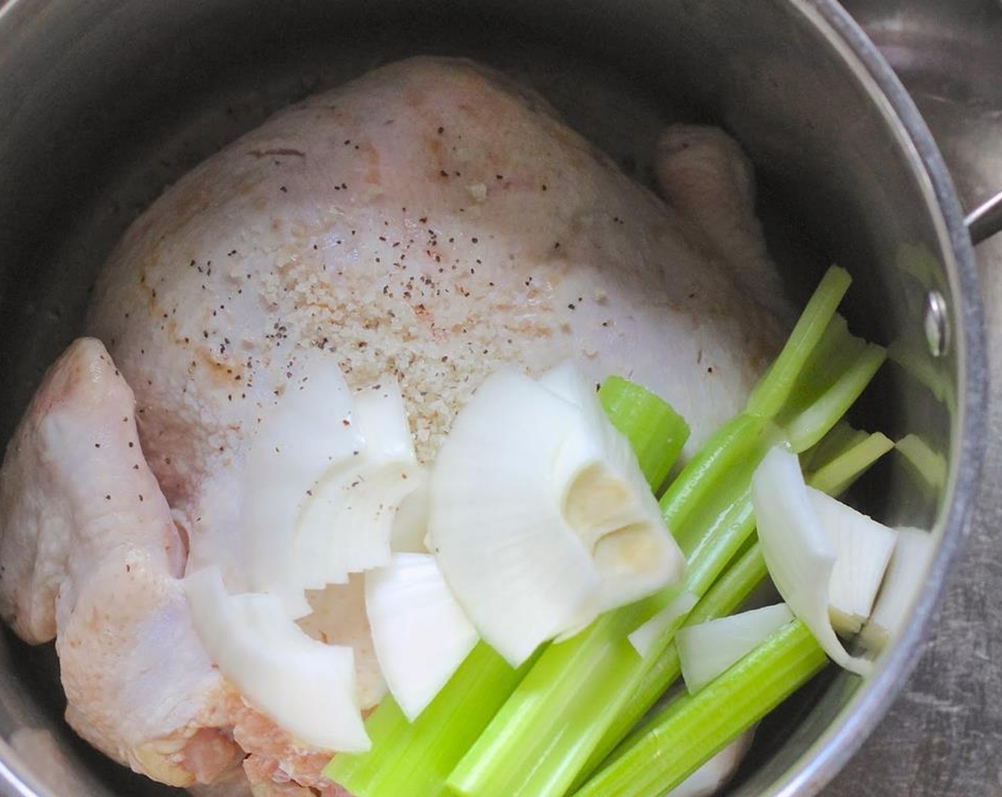 step 1 Place Whole Chicken (1) in a large stockpot with the Onion (1) and Celery (2 stalks).