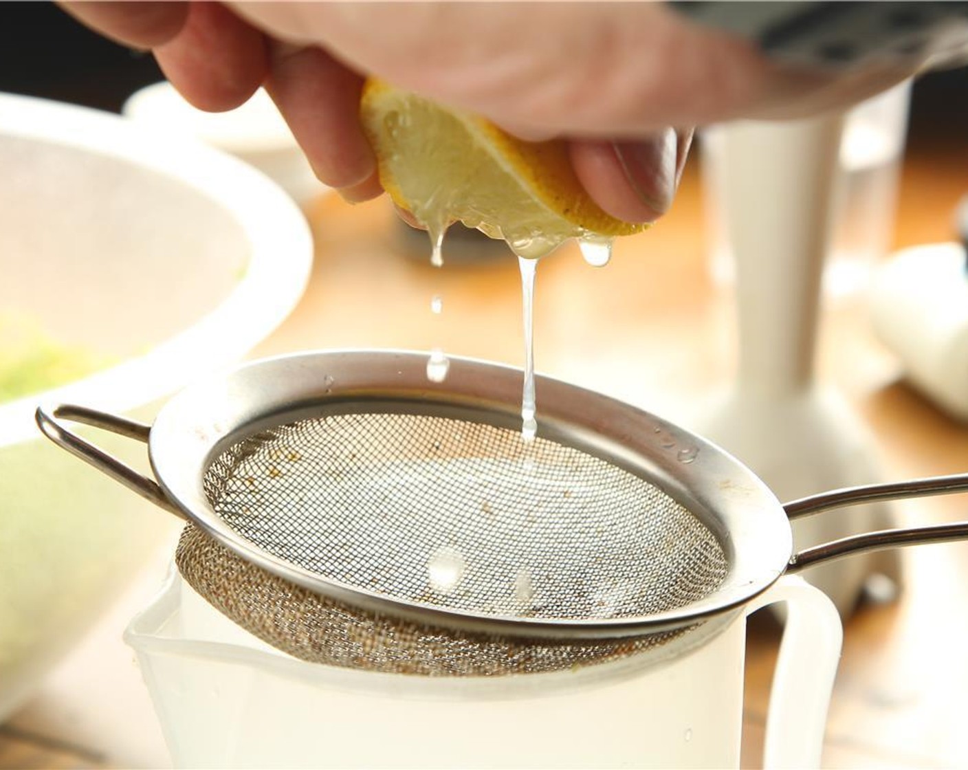 step 4 Juice the Lemon (1/2) into a large enough jar or pitcher to make the dressing.