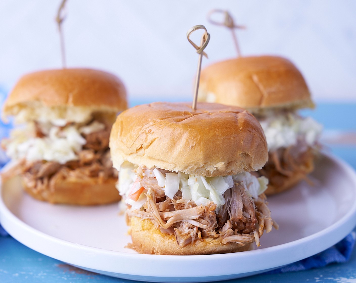 step 6 Use the tongs the serve the pulled pork onto the Slider Buns (4) and top with Coleslaw Mix (2 cups). Enjoy!