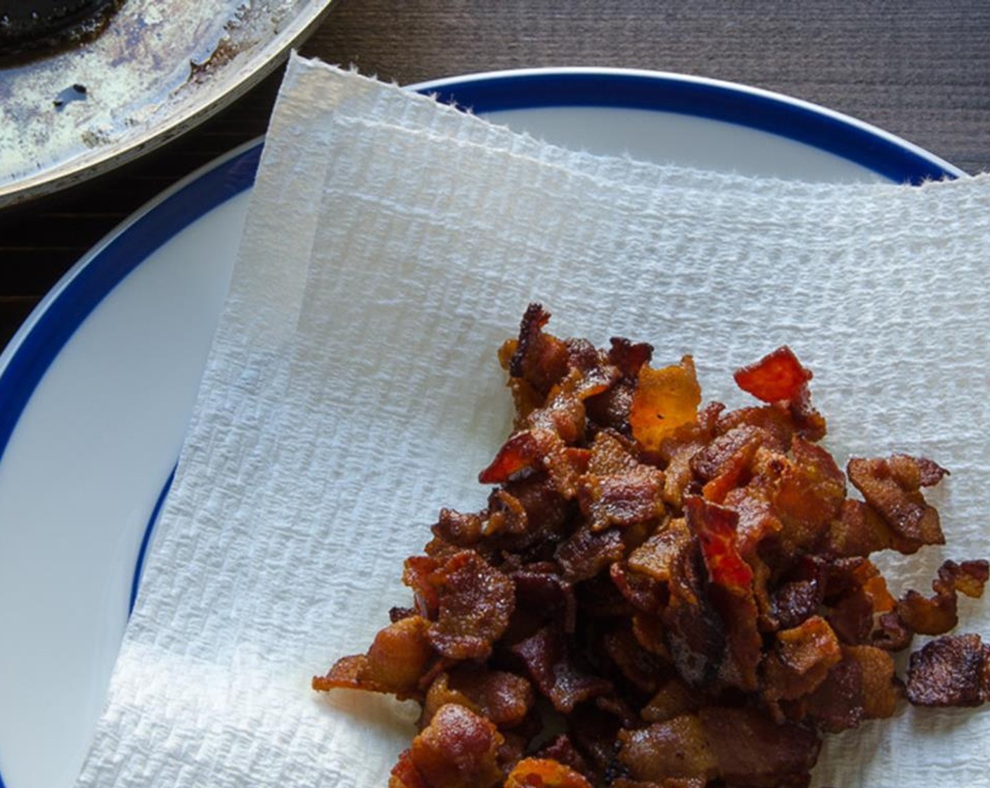 step 3 Heat a skillet over medium- medium high heat and add diced Bacon (7 slices). Cook, stirring occasionally until bacon is browned and crisped. Transfer the bacon to a plate lined with paper towels and set aside. Reserve rendered bacon fat (about 2 tablespoon).