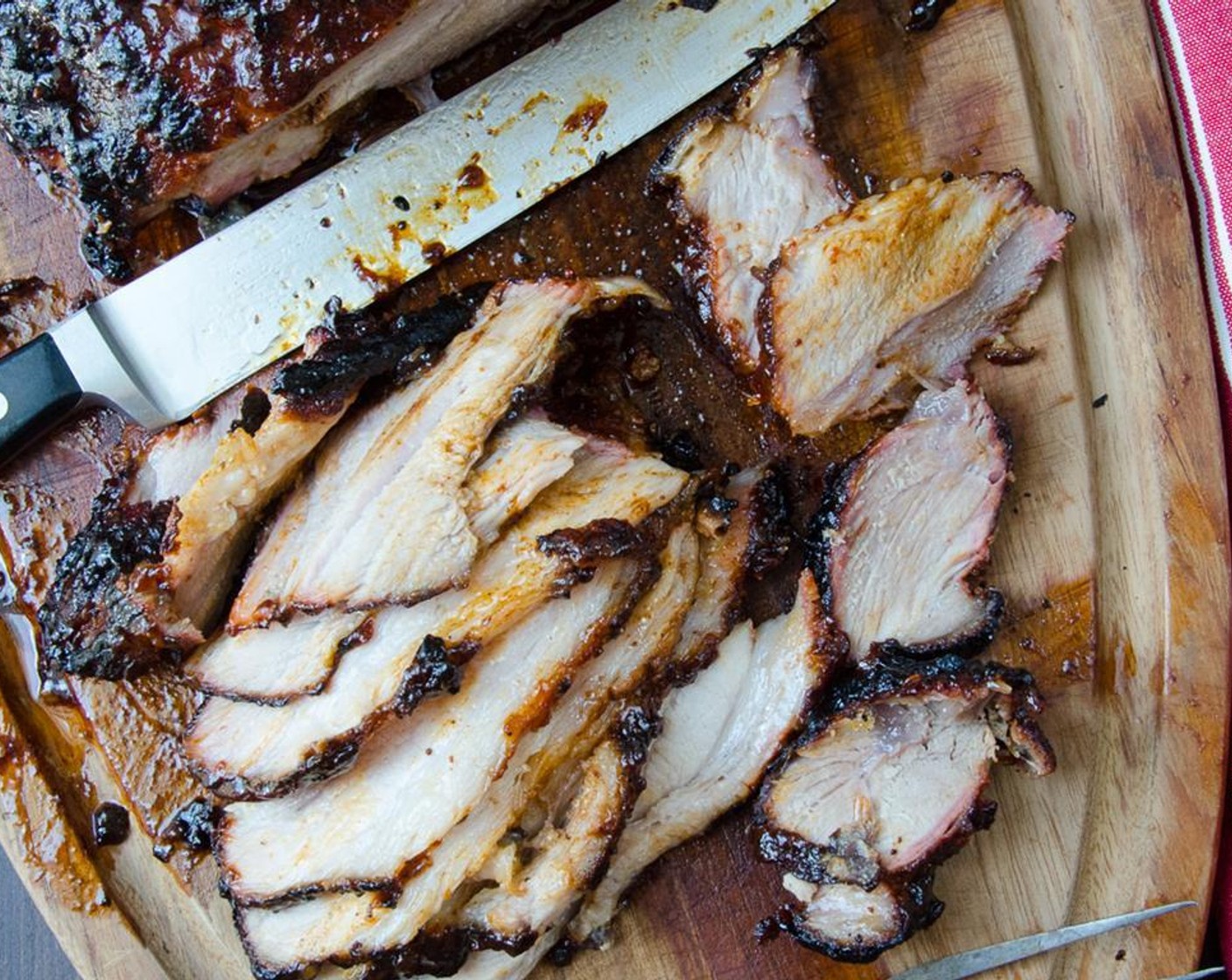 step 15 Using a very sharp knife, slice the pork as thinly as possible across the grain.