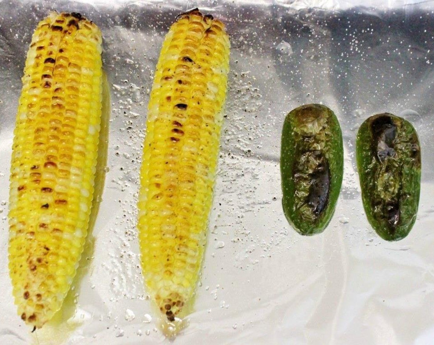 step 2 Broil for about 5-10 minutes, flipping the corn halfway through but not the jalapeno (broil the skin side only).