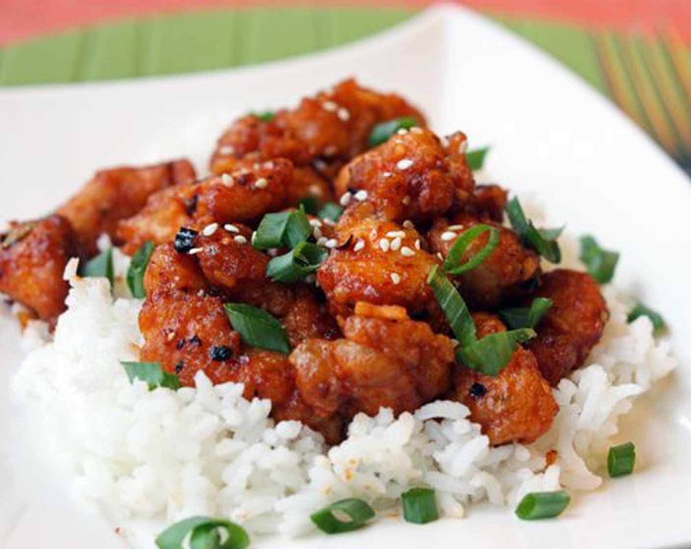 step 9 Serve over a bed of rice, garnished with Sesame Seeds (to taste) and Scallions (to taste). Enjoy!