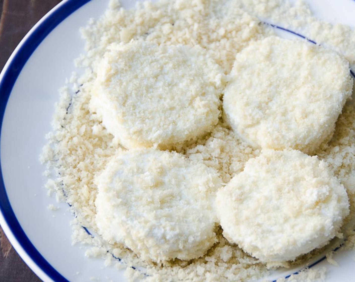 step 7 Place the Panko Breadcrumbs (1/2 cup) in a dish and place goat cheese slices on top, lightly pressing the bread crumbs into the cheese. Flip the cheese and coat the other side with the bread crumbs.