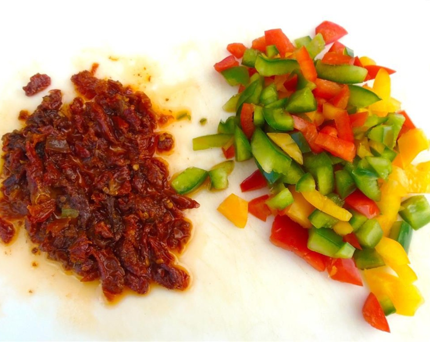 step 8 Coarsely chop the Sun-Dried Tomatoes in Olive Oil (2 cups) and the Assorted Color Bell Peppers (1 cup), Fresh Cilantro (2 Tbsp), minced garlic.