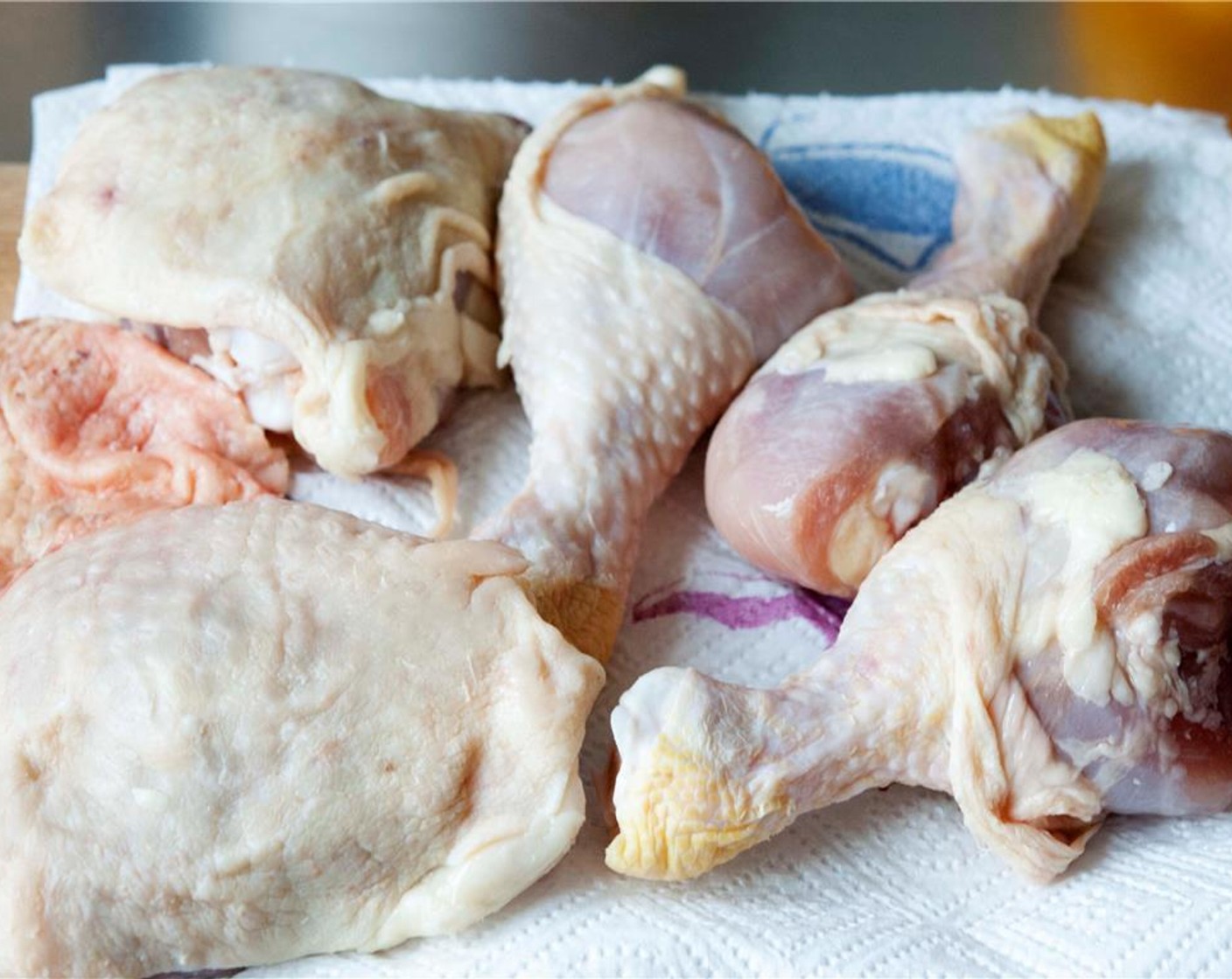 step 1 Pat the Chicken Thighs (4) and Chicken Drumsticks (8) dry with some kitchen paper.
