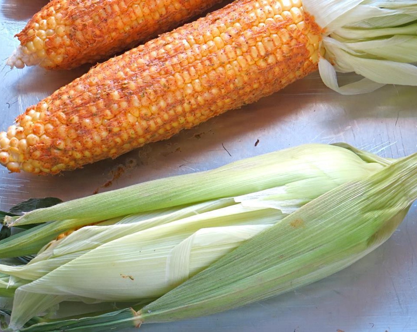 step 4 Gently fold the husks back over the corn until they are covered.