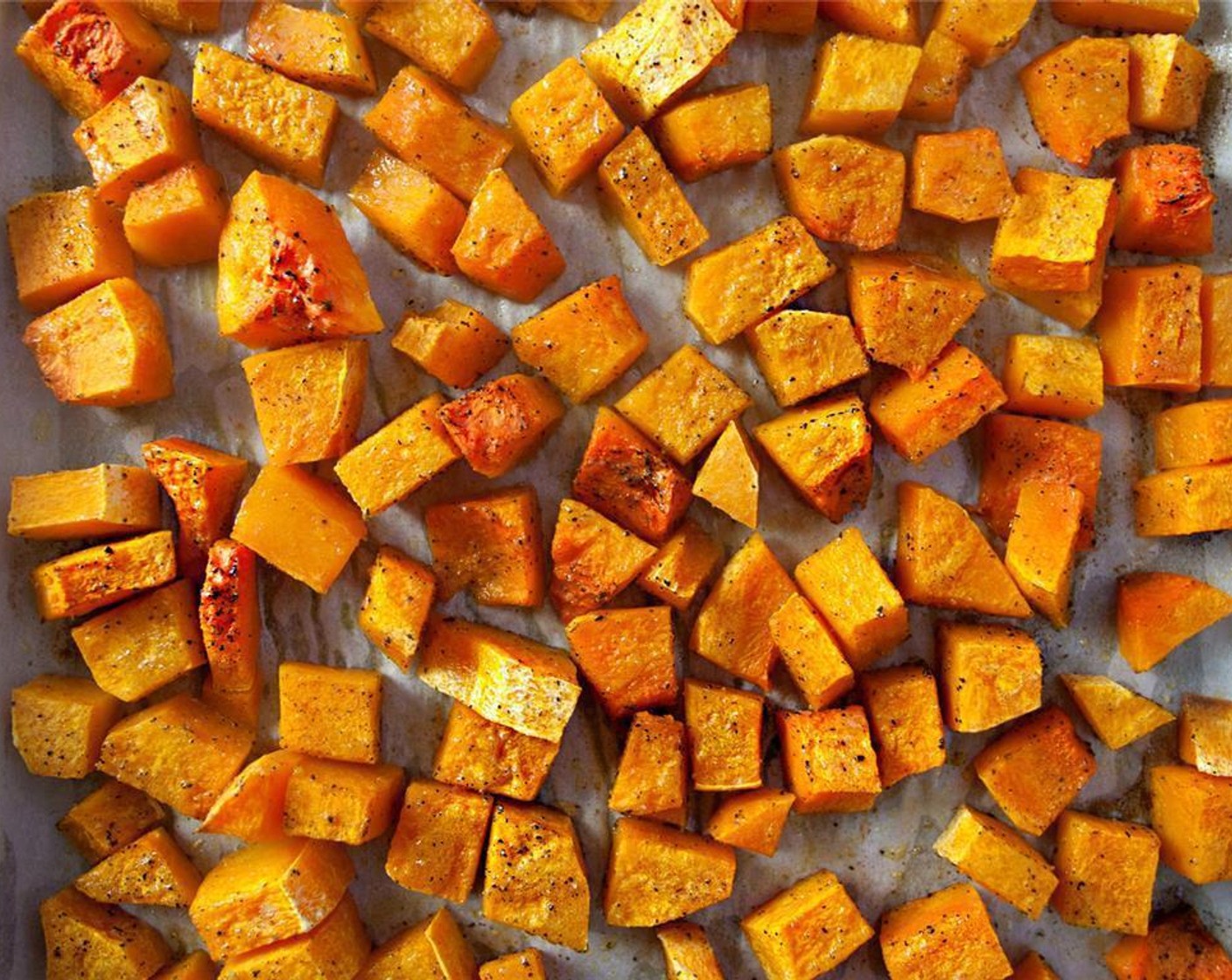 step 2 On a parchment lined baking sheet, scatter the small Butternut Squash (1) and drizzle with Olive Oil (1 Tbsp). Sprinkle with Kosher Salt (1/4 tsp) and Ground Black Pepper (1/4 tsp) and toss to coat.