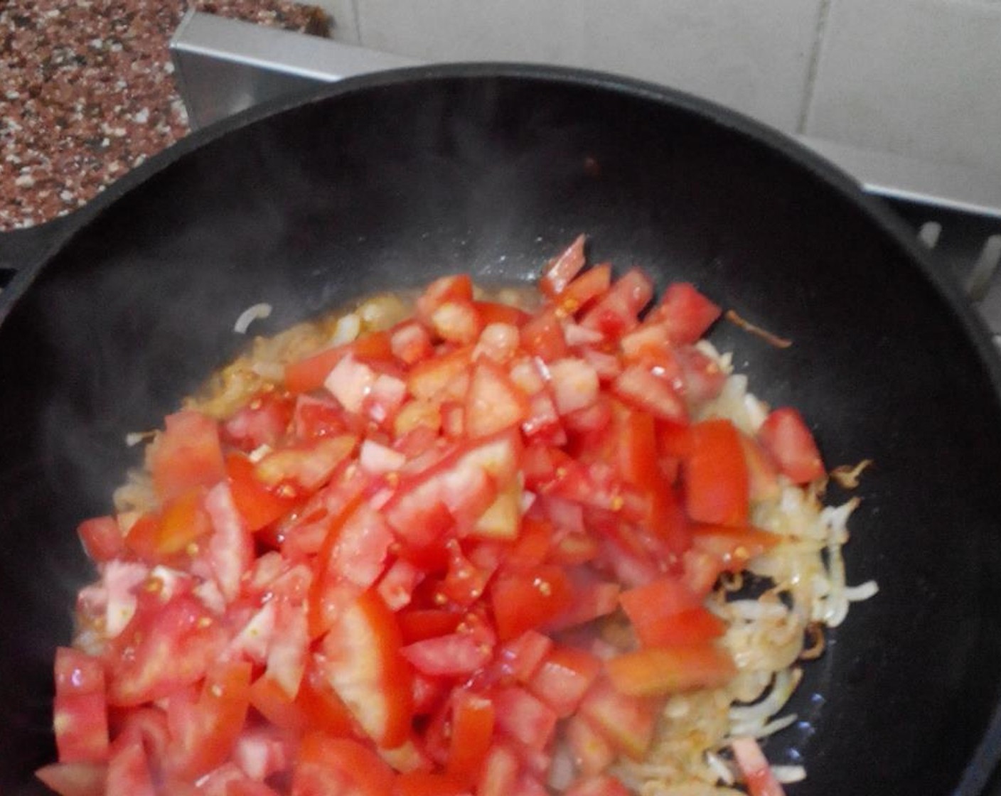 step 4 Add the diced tomatoes and garlic to the pan. Put the lid on and cook for about 20 minutes untill the tomatoes break down into a sauce.