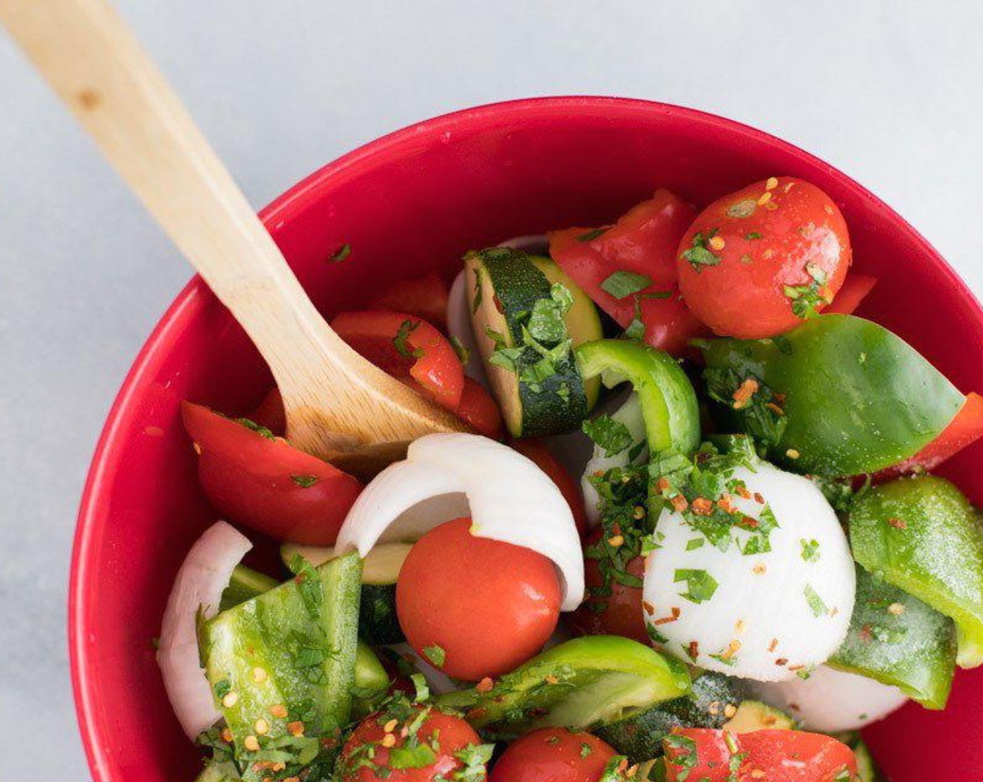 step 2 In a large mixing bowl, blend together all the cut vegetables, Cherry Tomatoes (12), Lemon (1/2), Extra-Virgin Olive Oil (1/4 cup), Crushed Red Pepper Flakes (1/4 tsp), Fresh Parsley (2 Tbsp), and Salt (1/2 tsp). Set aside.