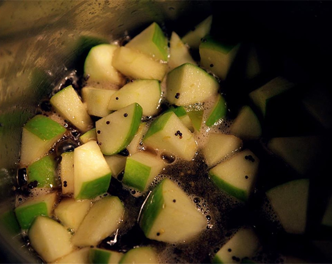 step 3 Add Green Apple (1) to the pot. Stir to combine w/ the oil and mustard seed and add the currant mixture and Kosher Salt (to taste). Boil, then reduce to a simmer, and cook for 10-15 min. Add Dijon Mustard (1/2 tsp) while hot, and set aside.