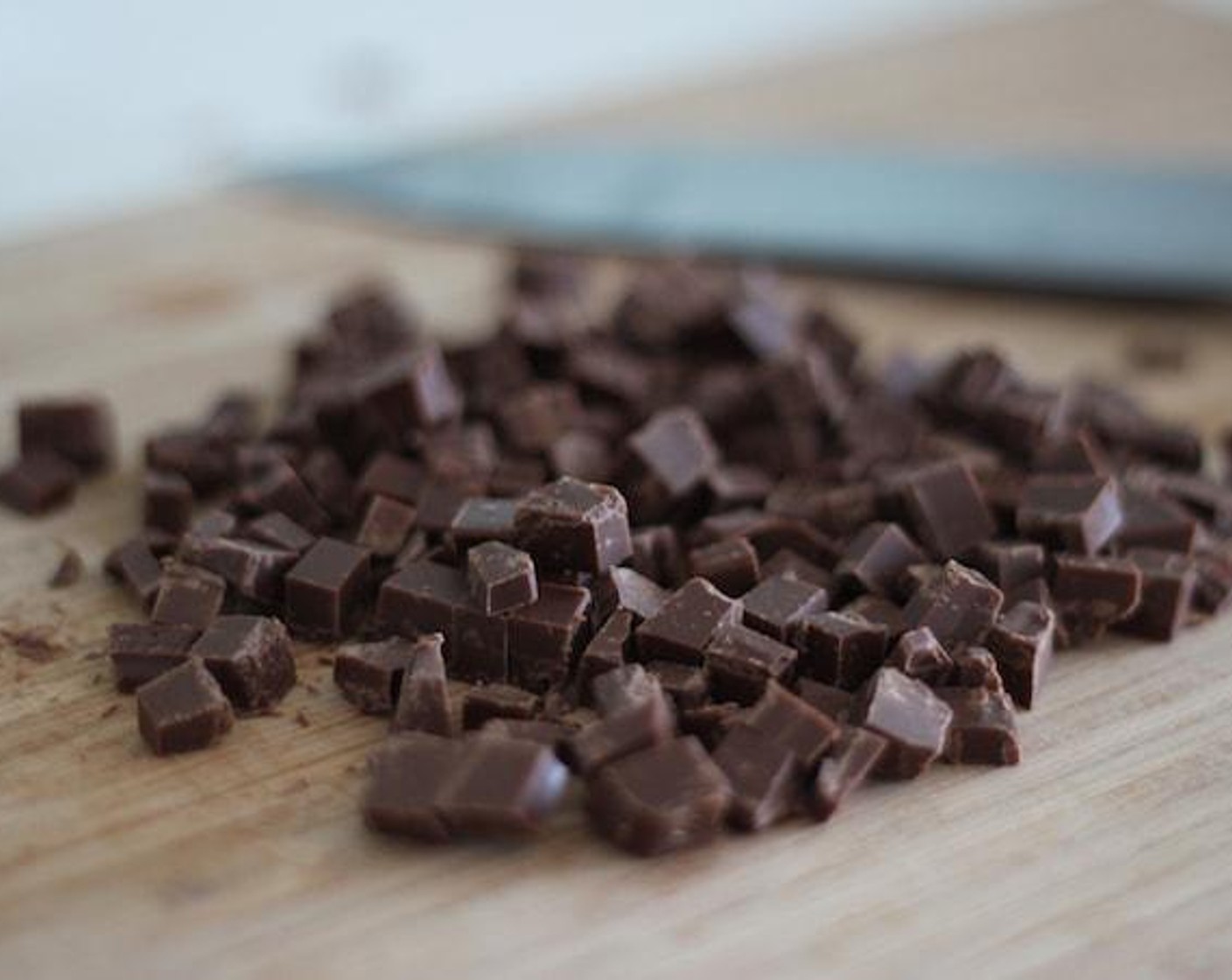 step 3 While waiting for the nuts to be roasted, chop the Vegan Chocolate Chips (1 cup) into pieces. These are going to be mixed with the rest of the ingredients later.