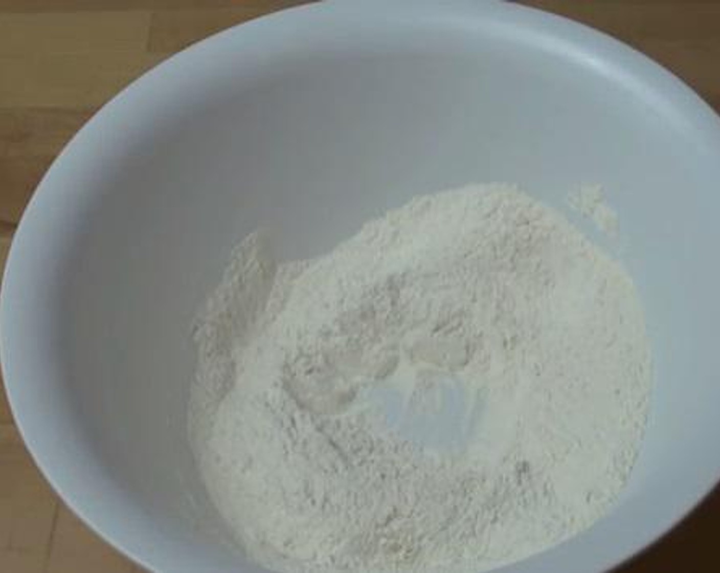 step 1 In a mixing flour, mix together the Self-Rising Flour (2 cups), Caster Sugar (4 Tbsp), and Baking Soda (1/4 tsp). Stir the mixture well.