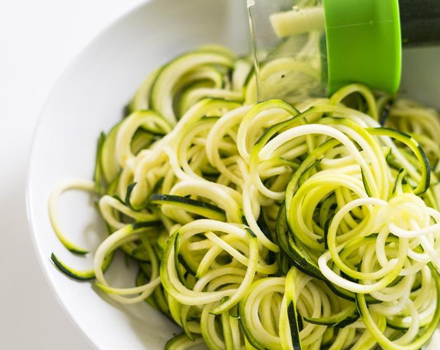 step 5 Using a spiral cutter, spiralize the Zucchini (5) into noodles.