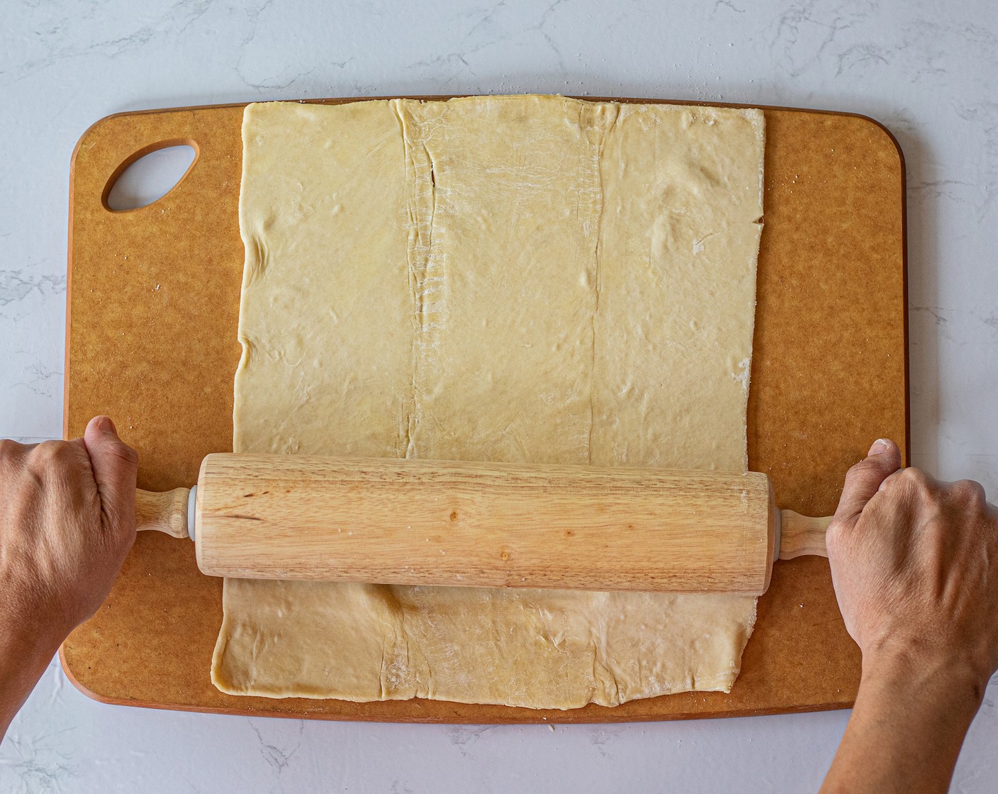 step 2 With a rolling pin, flatten the Puff Pastry (2 sheets) as much as you can. Work with one sheet at a time.