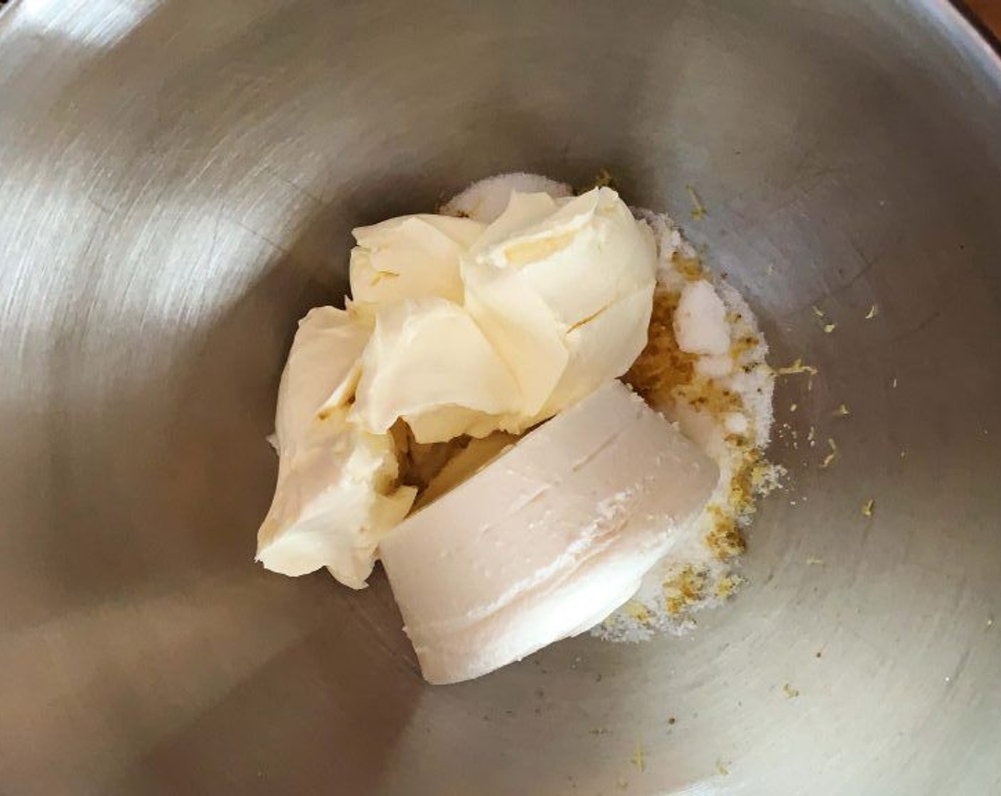 step 4 In a bowl of your electric mixer, place Granulated Sugar (1/2 cup), Cream Cheese (1 cup), zest of the Lemon (1) , and Ricotta Cheese (1 cup). Stir until creamy.