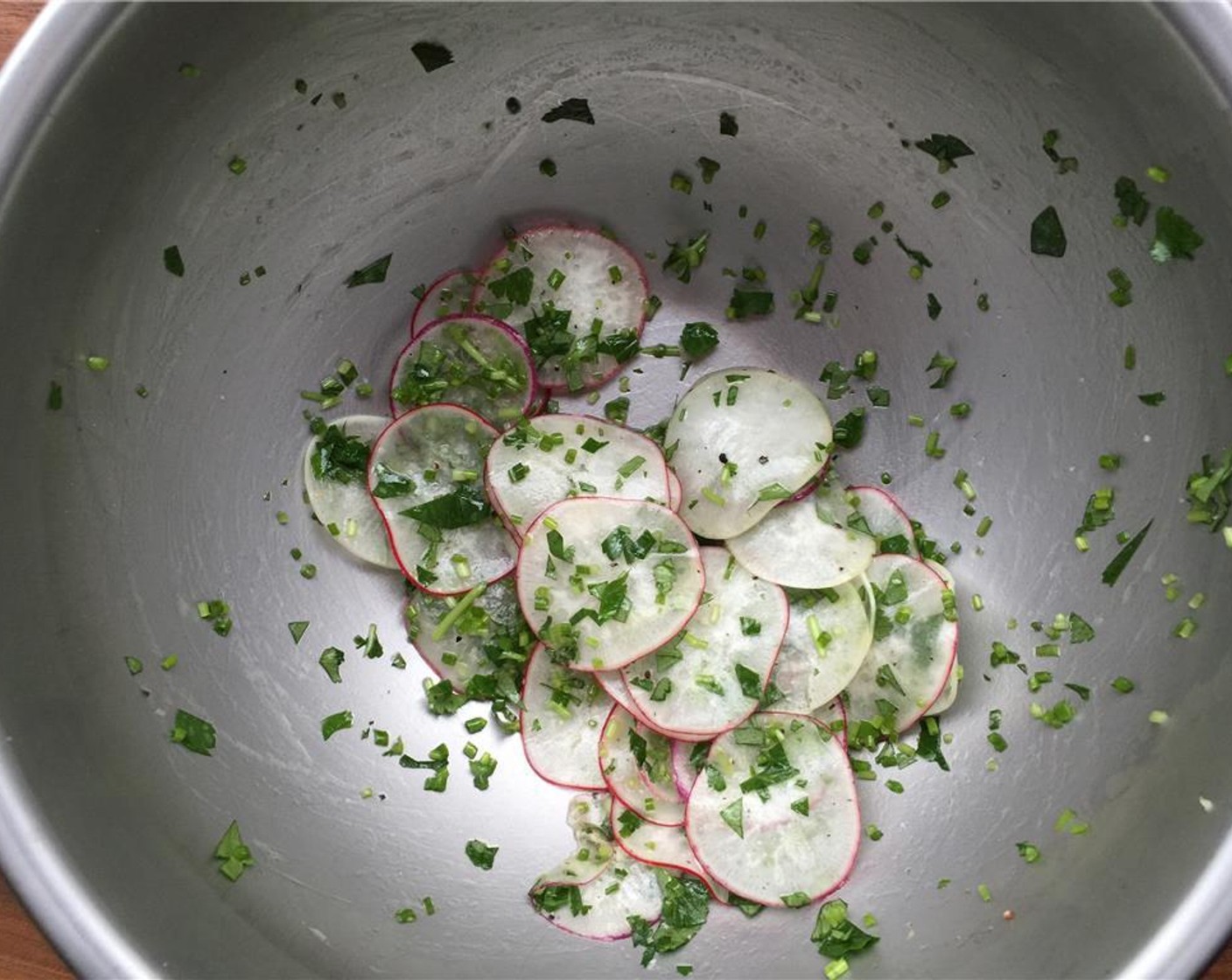 step 9 In a small bowl toss together the Radish (1 cup), Fresh Chives (4 Tbsp), Italian Flat-Leaf Parsley (4 Tbsp), Kosher Salt (to taste), Freshly Ground Black Pepper (to taste), juice from Lemon (1) and Extra-Virgin Olive Oil (1 Tbsp).