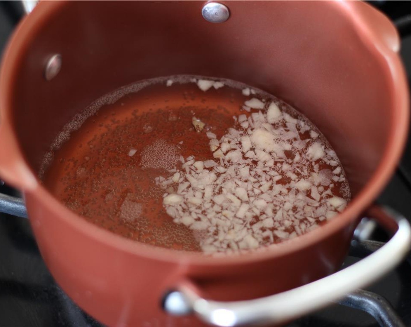 step 3 Add Chardonnay (3/4 cup) to the pot and heat slowly, just until the liquid begins to bubble.