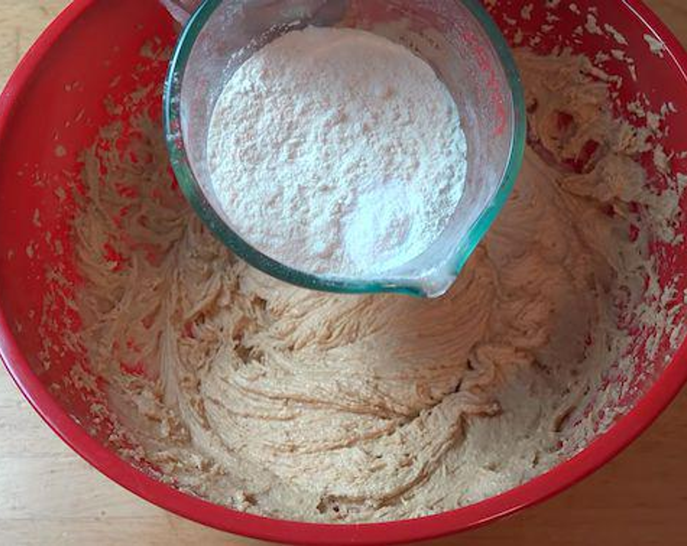 step 3 Sift in the All-Purpose Flour (1 1/4 cups) and Baking Powder (1 tsp) and using a spatula, mix everything together until combined.