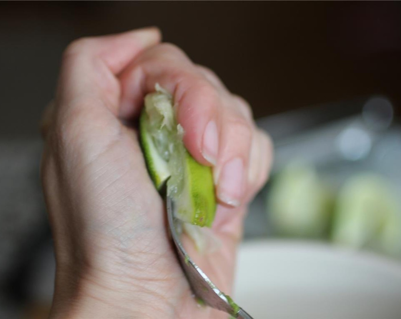 step 3 Take the Lime (1/2) and squeeze the juice into the bowl.