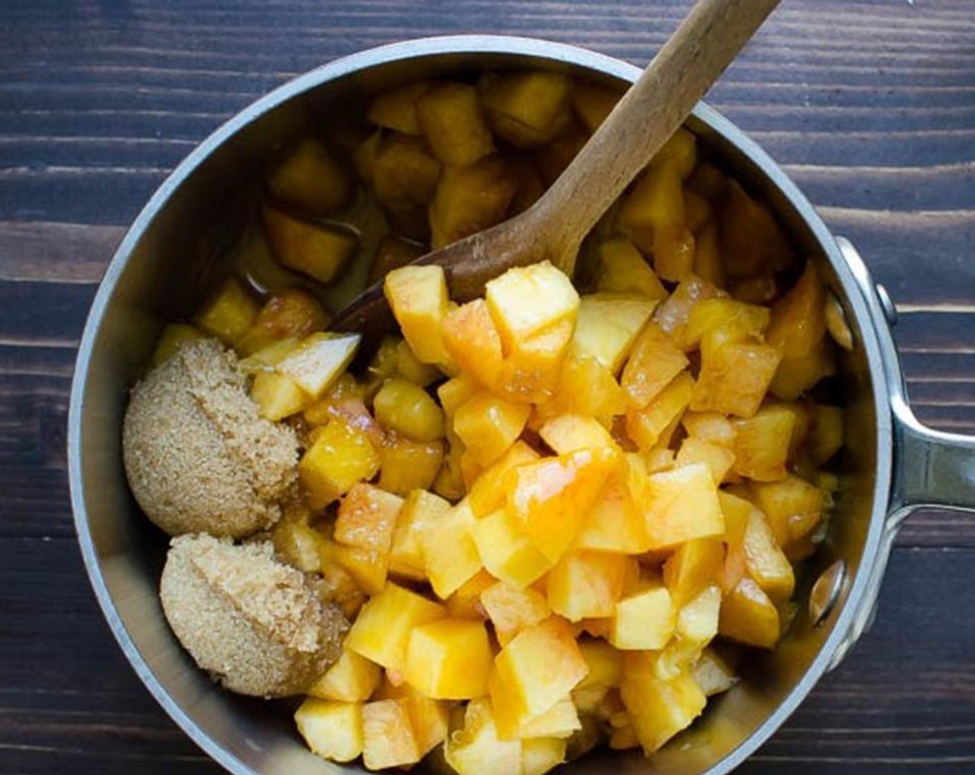 step 4 In a saucepan, combine Peaches (4), Brown Sugar (2 Tbsp), Bourbon (1 1/2 Tbsp). Bring to a boil, reduce heat to a simmer annd stir until the sugar is dissolved.