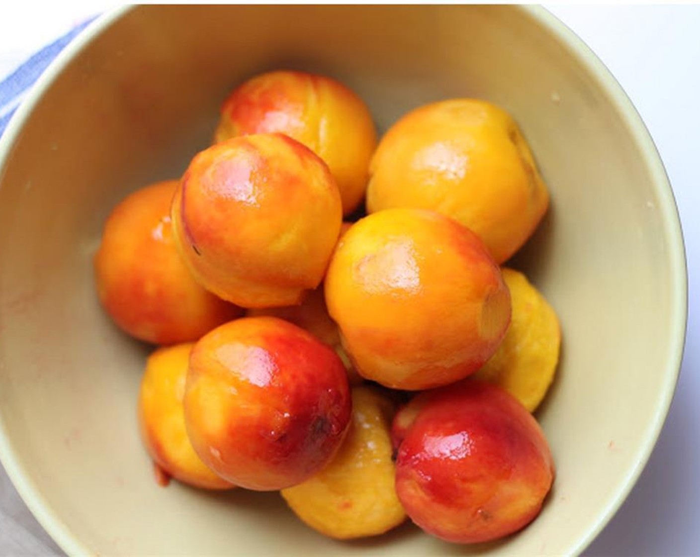 step 2 Blanch the Peaches (5) in boiling water for about 2 minutes then strain and cool; the skins will slip right off; then pit them.