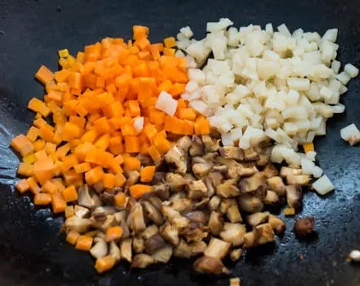 step 7 Add into the same pan the shiitake mushrooms, Carrot (1), and Water Chestnuts (1/3 cup) and stir-fry for 1–2 minutes.