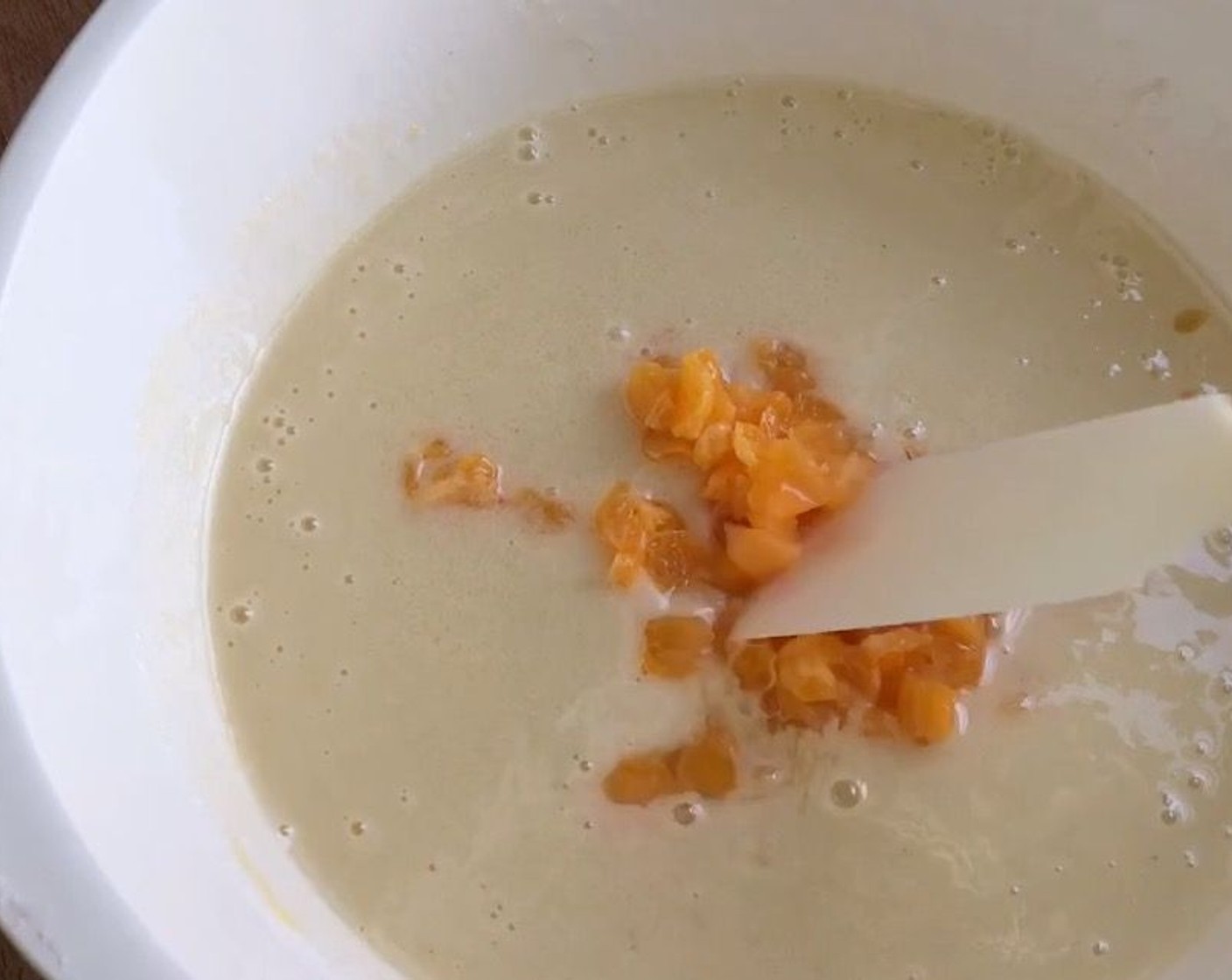 step 7 Then add Coconut Milk (1 1/4 cups). Lastly fold in the chopped mandarin orange and mix till combined.