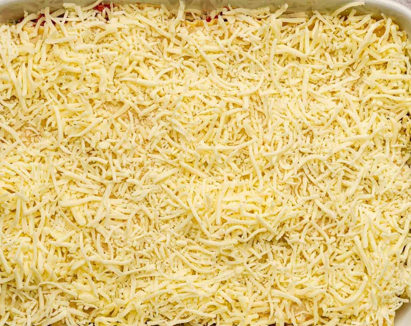 step 13 Repeat the layers two to three more times until you run out of noodles. Layer the top layer of lasagna noodles with the last of the béchamel sauce, remaining parmesan cheese, and Mozzarella Cheese (1/2 cup).