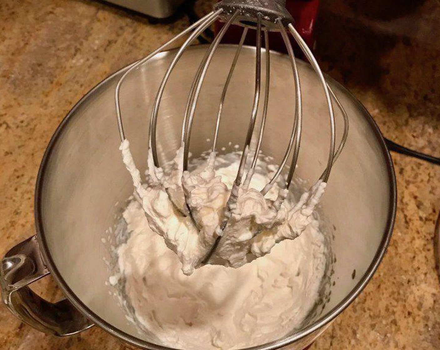 step 8 Remove the mixing bowl from the freezer and pour Heavy Cream (1 cup) into bowl. Beat on high for 2 minutes until fluffy, then add Hot Chocolate Mix (1 cup) and continue to beat until stiff peaks form. Keep refrigerated.