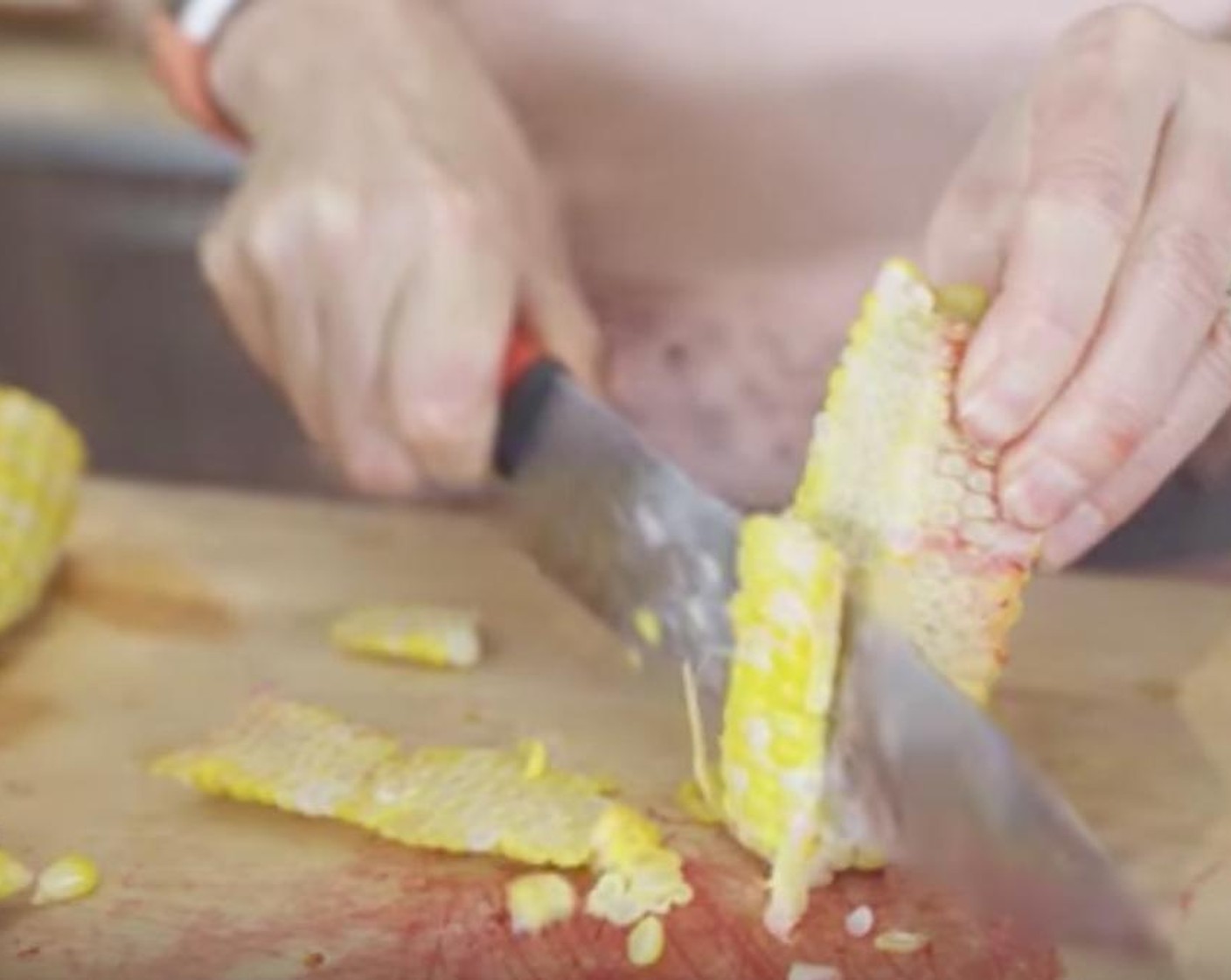 step 3 When the cobs of corn are ready, cut the kernels off until all of them are off the cob.