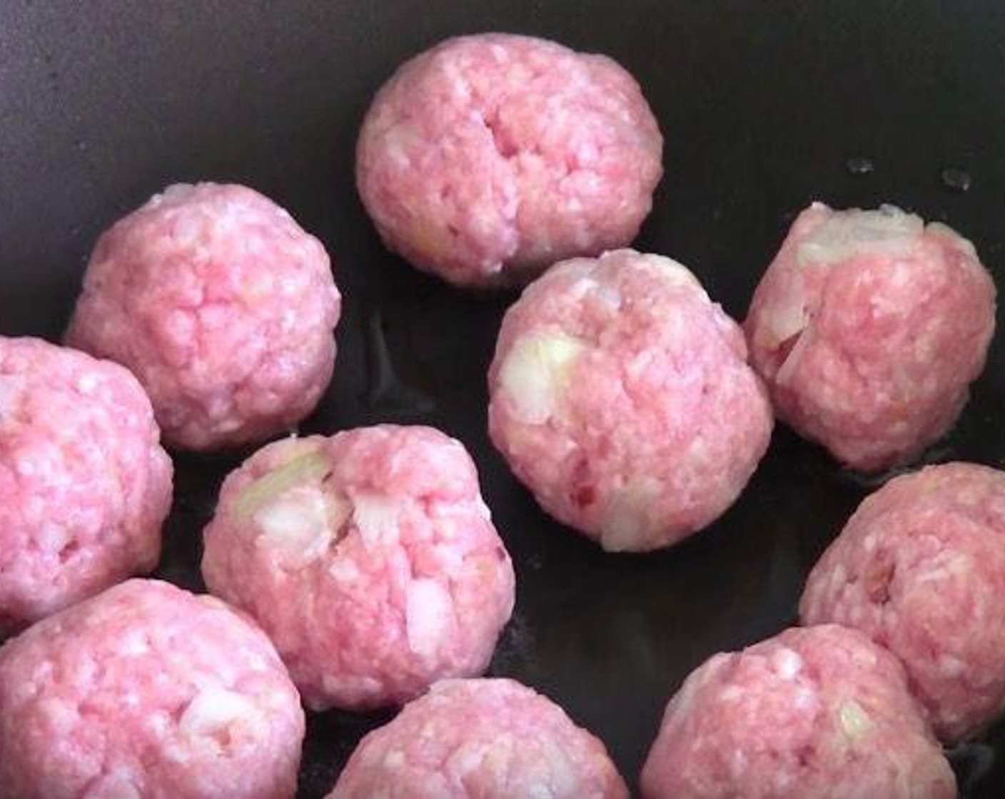 step 2 Put oil into a fry pan and cook the meatballs in batches to brown the outside for about 4 to 5 minutes. Transfer them to a large casserole dish.