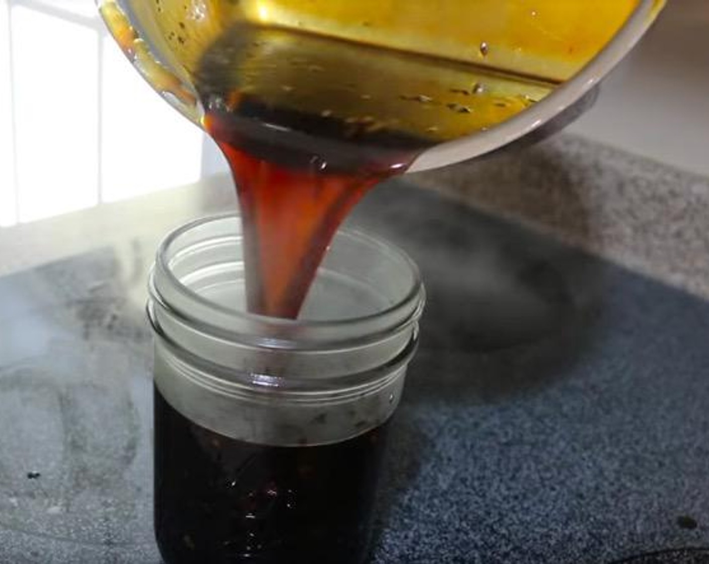 step 4 In a separate bowl, combine the Corn Starch (2 Tbsp) and Water (2 Tbsp). Slowly add the slurry to the sauce pot while stirring. Bring the mixture to a boil and reduce the heat. Pour the General Tso’s Sauce into a jar and allow to cool.