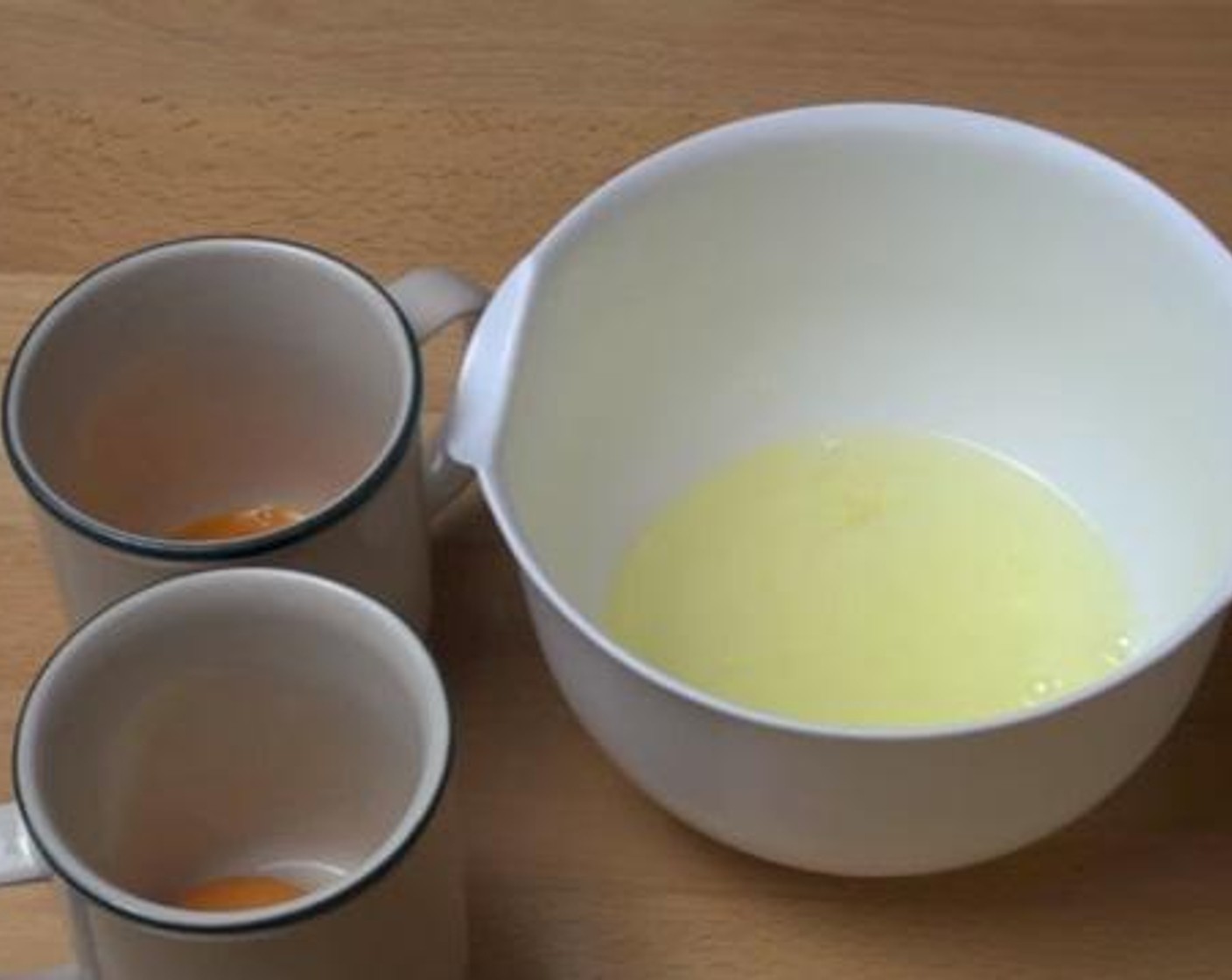 step 2 Put the whites of the Eggs (2) in a bowl, and the yolks in two separate cups.