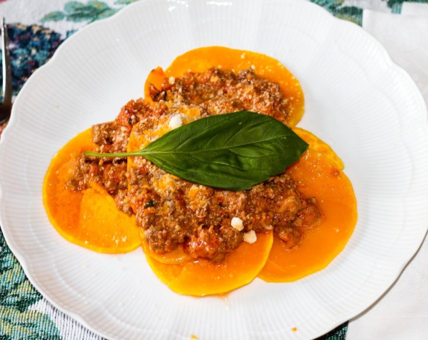 step 10 Plate the sliced butternut squash and add the sauce. Garnish with parmesan and basil.