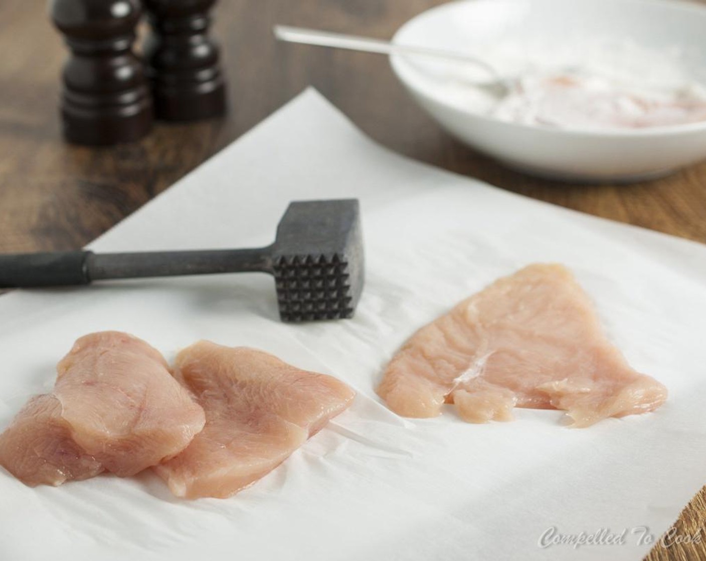 step 4 Place each piece, including fillet between two pieces of parchment paper. Pound with a flat mallet until 1/4" thick.