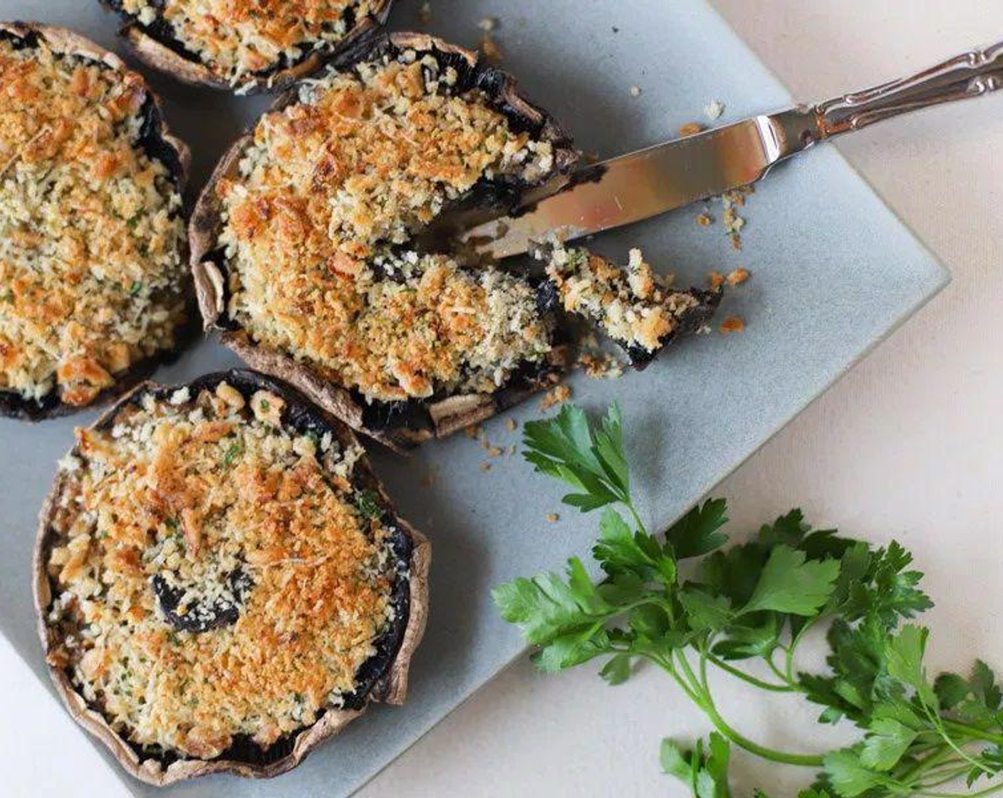 step 4 After baking for 25 minutes, remove the mushrooms and top generously with the topping mixture. Put mushrooms back in oven to bake for an additional 5 minutes.