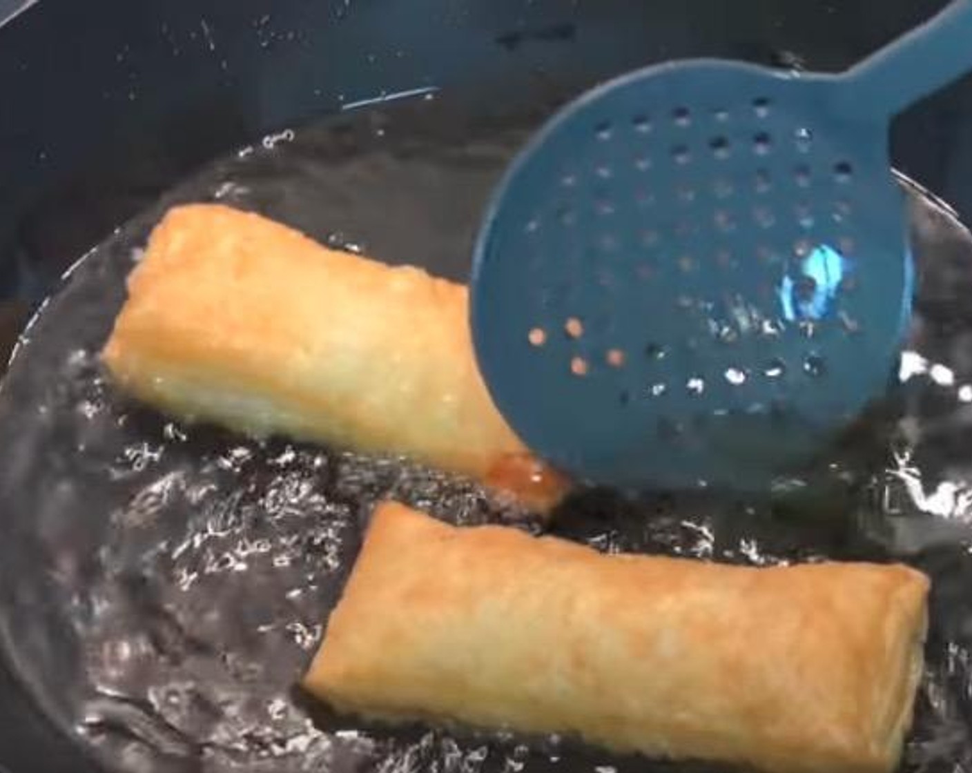 step 5 In a wok, heat up Vegetable Oil (as needed). Place apple pies in a few at a time and allow to cook for 2-3 minutes, until golden and puffy.