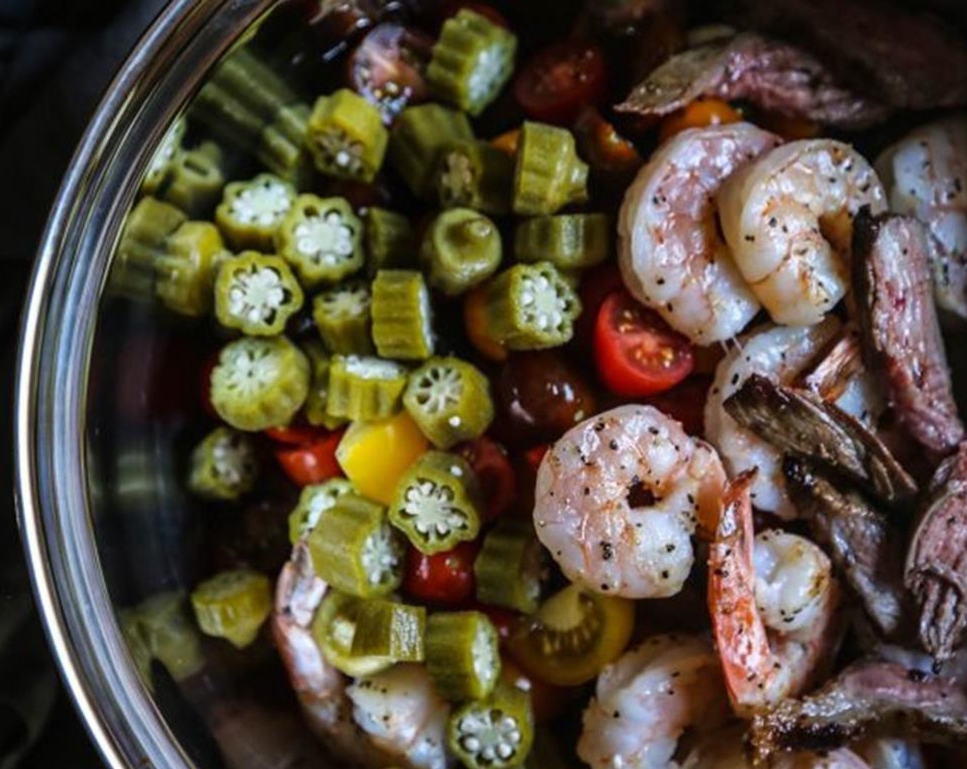 step 7 To make the salad, add croutons, Cucumbers (3 cups), Grape Tomatoes (4 cups), shrimp, Flank Steak (1 lb), Okra (1 cup), Red Onion (1 cup), Fresh Chives (to taste), Extra-Virgin Olive Oil (1/4 cup), and Balsamic Vinegar (to taste). Season with salt and pepper.