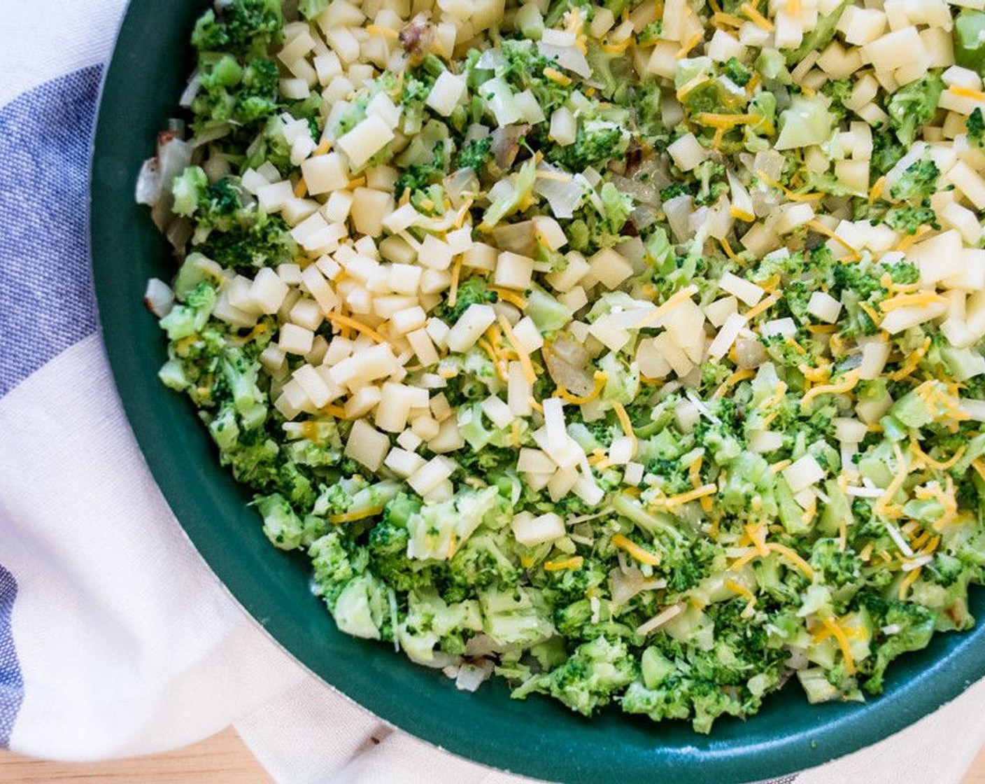 step 8 Add in chopped broccoli, Almond Milk (1/2 cup), chopped aged cheddar, Shredded Triple Cheddar Cheese Blend (1/4 cup), Salt (1/4 tsp), Ground Black Pepper (1/8 tsp), and McCormick® Garlic Powder (1/4 tsp).