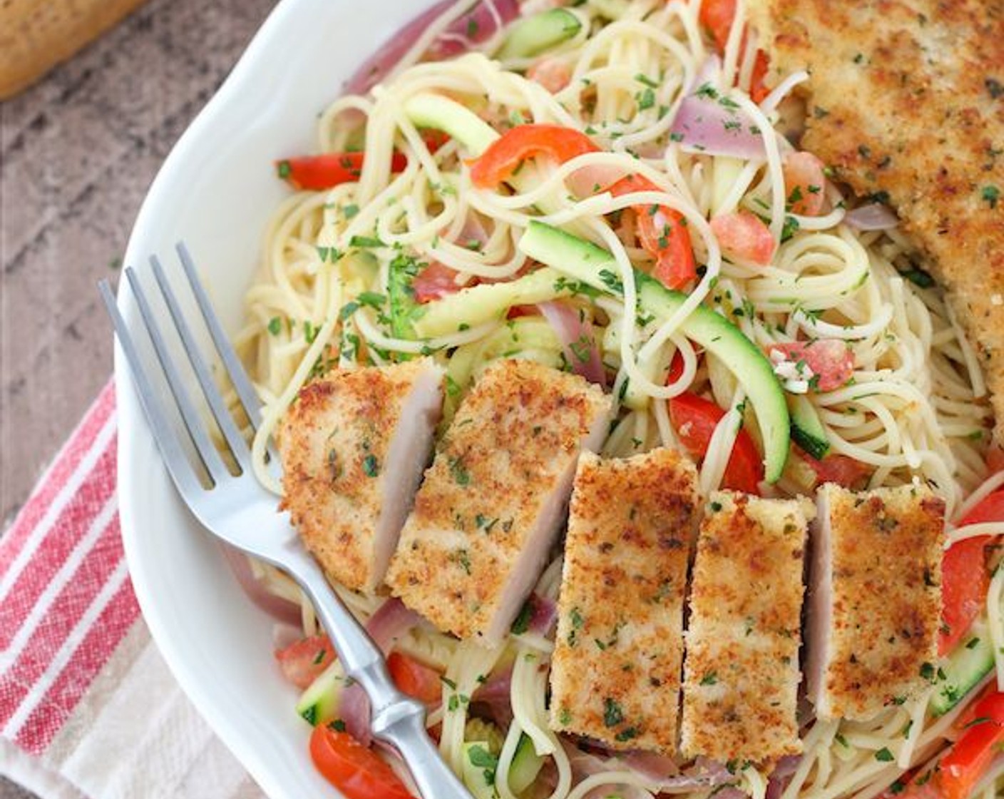 step 17 Serve with the breaded chicken tenders. You can add more parmesan cheese to each plate and garnish with more fresh herbs.