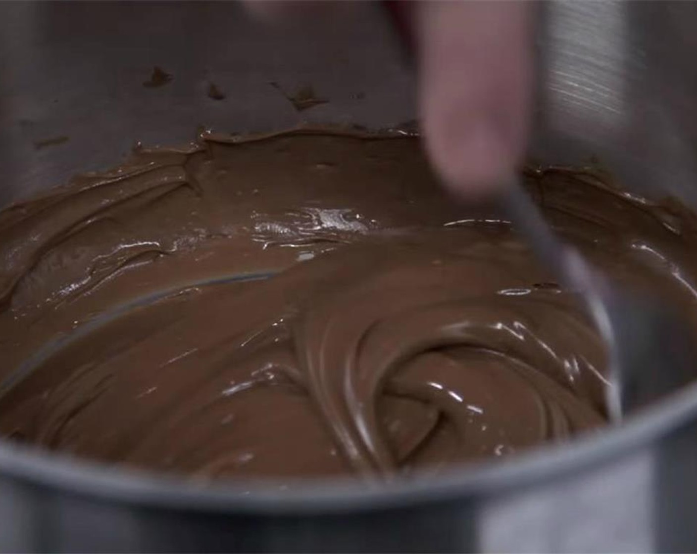 step 4 Keep stirring on low heat to prevent the chocolate from burning. Once melted and smooth, set aside.